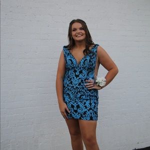 i am selling a sparkly blue tight homecoming dress. it is a ava presley size 14.